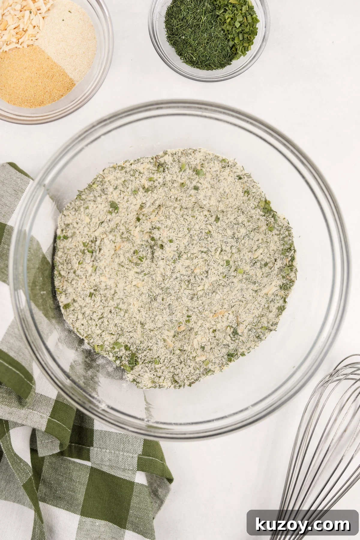 Homemade Ranch Seasoning Mix Recipe for Dips & Dressings 6 A bowl of homemade ranch seasoning, with a whisk to the side.