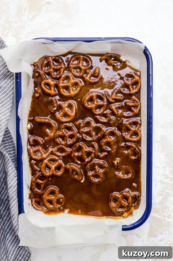 Salted Pretzel Toffee Bark Recipe for Irresistible Snacking 3 overhead process shot pretzel toffee bark