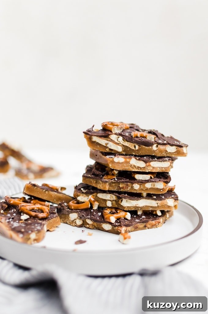 Salted Pretzel Toffee Bark Recipe for Irresistible Snacking 5 stacked pretzel toffee bark on a plate