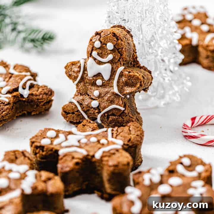 gingerbread man blondie propped up onto a clear glass Christmas tree