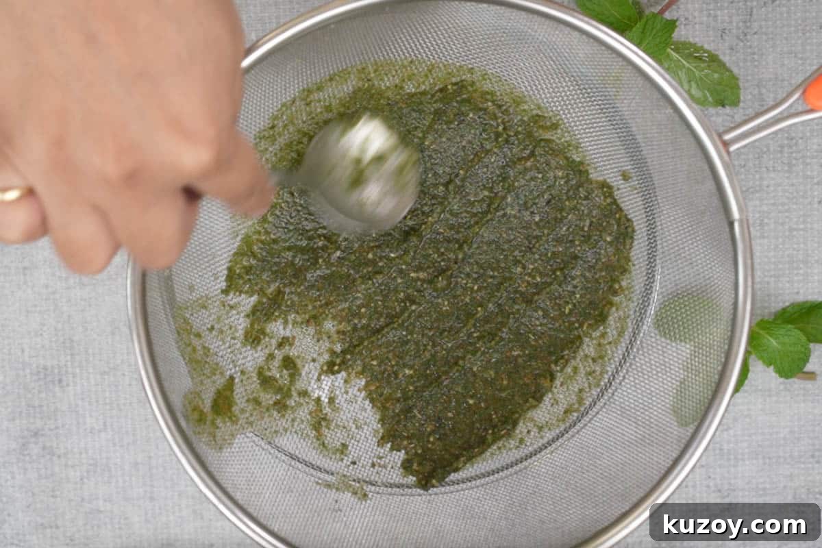 Passing the mixture through a strainer.