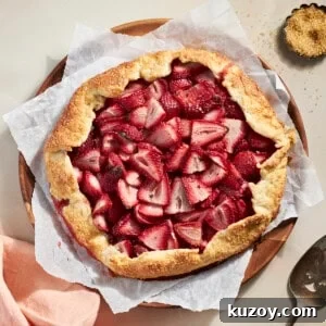 Sourdough Discard Strawberry Galette on a wooden serving plate.