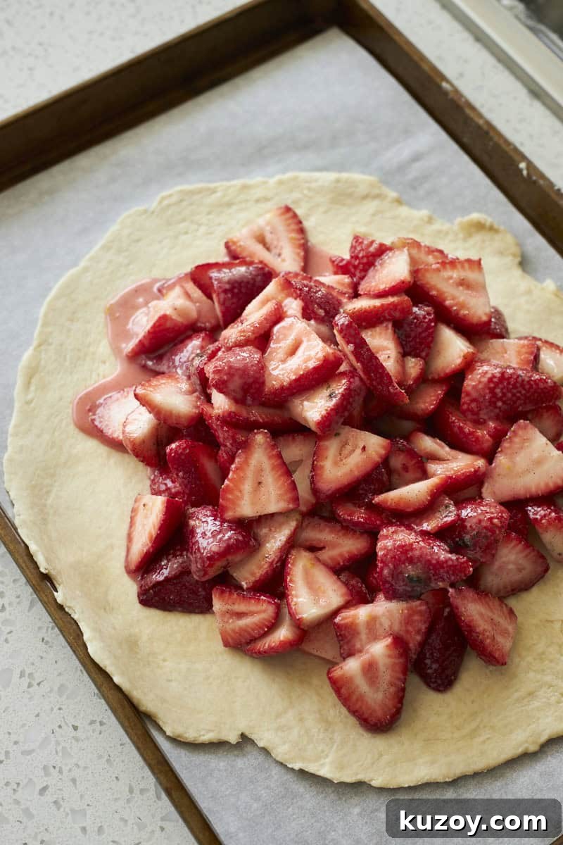 Strawberry filling piled into the center of the galette.
