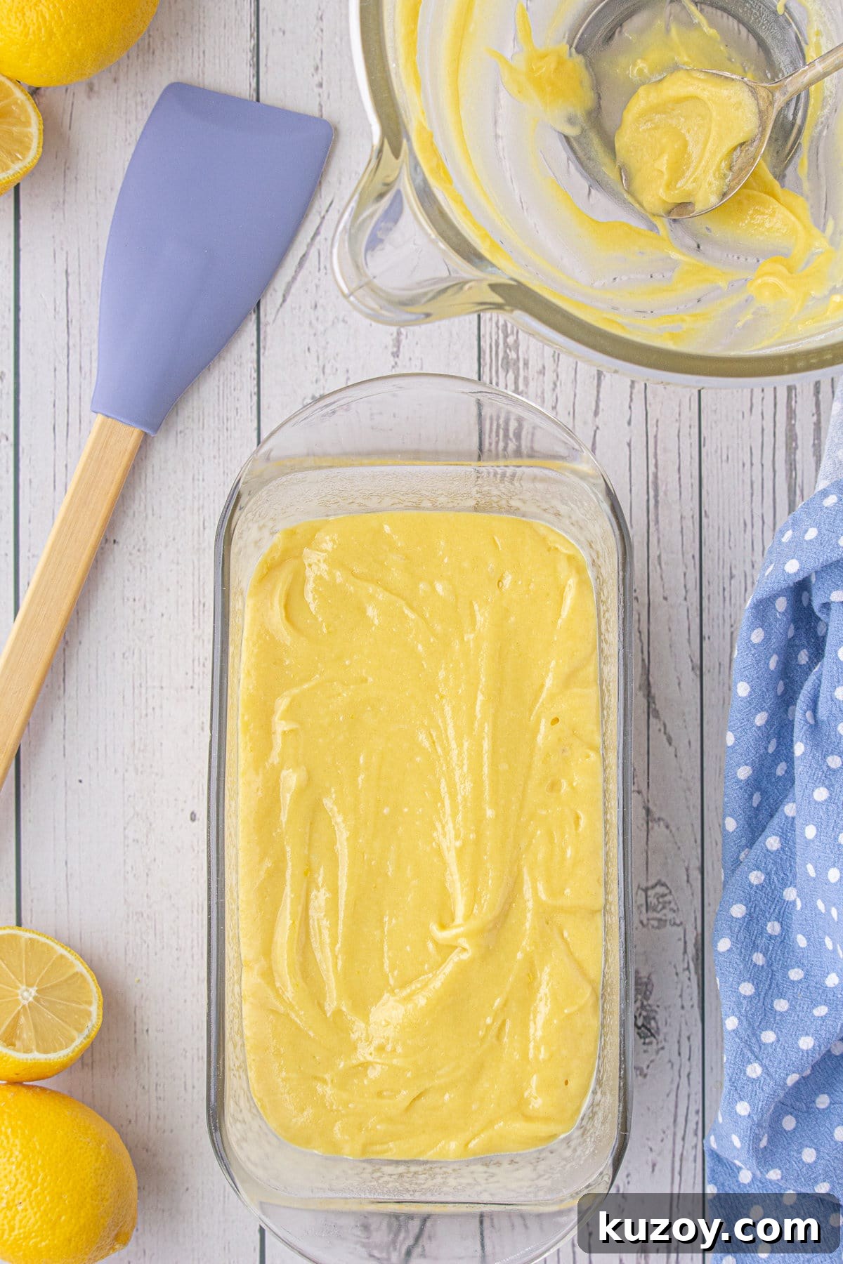 Starbucks-Style Lemon Loaf Recipe: Moist Citrus Quick Bread 8 Batter spread in a glass loaf pan.