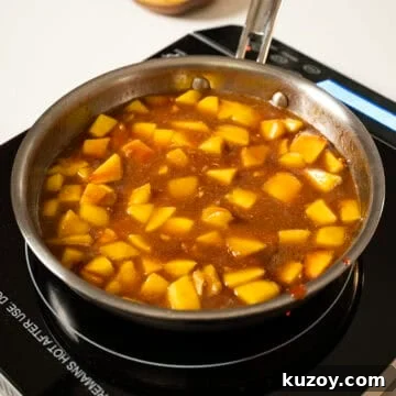 Peach Bourbon Glazed Pork Chops with Pan Sauce 6 Peaches simmering in the sauce.