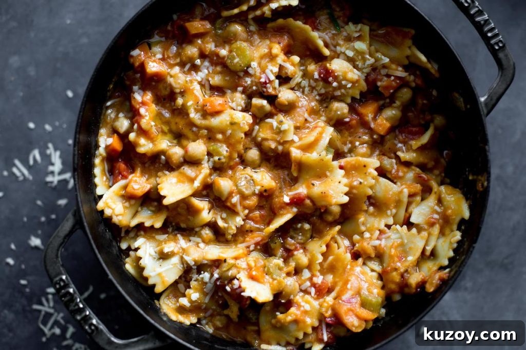 One-Pot Pasta e Ceci: Hearty Italian Pasta with Chickpeas 3 bowtie pasta with chickpeas in a dutch oven