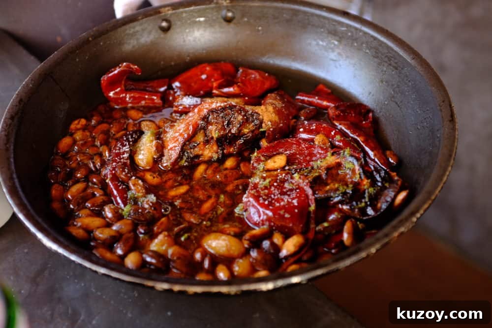 Orange-Almond Mole Sauce: Quick Recipe for Rich, Zesty Flavor 8 A skillet filled with almonds, chiles, tomatoes, garlic, honey and spices.