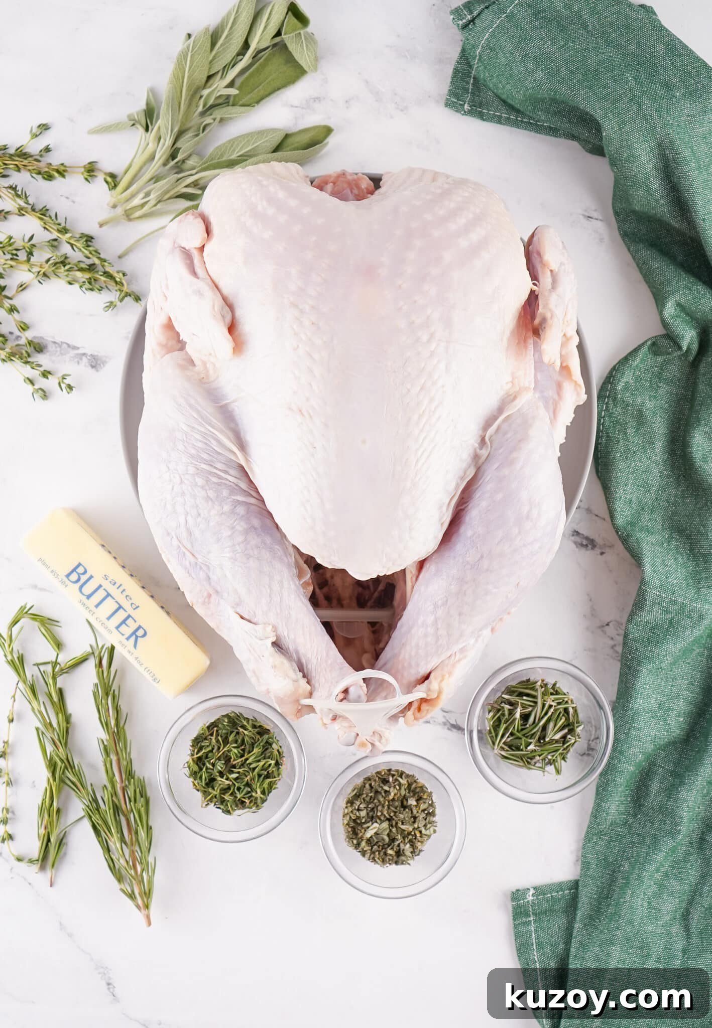 Herb-Butter Roasted Turkey Recipe for Juicy, Flavorful Results 5 overhead view of raw ingredients needed to make herb butter roasted turkey