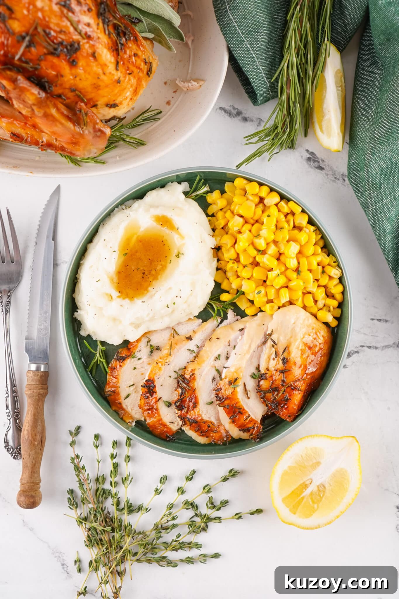 Herb-Butter Roasted Turkey Recipe for Juicy, Flavorful Results 6 overhead view of plate filled with herb butter roasted turkey and sides