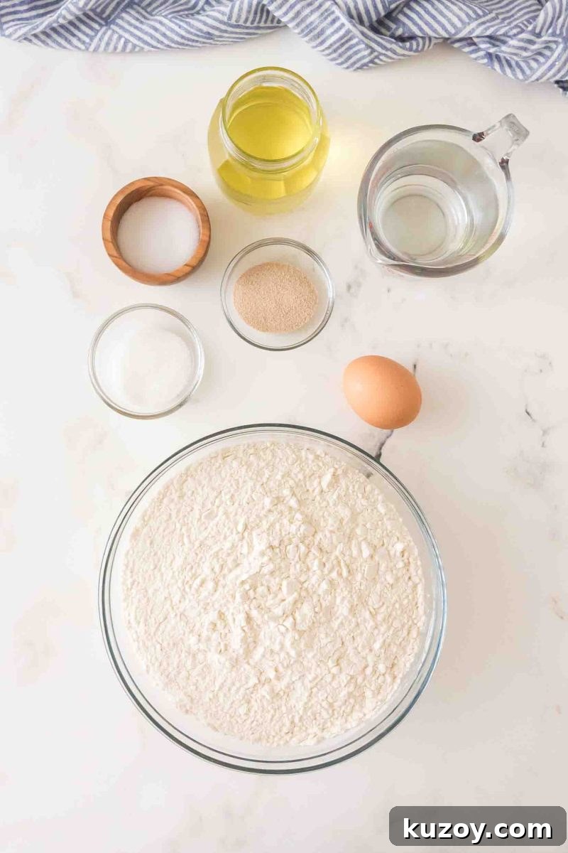 French bread ingredients: flour, yeast, warm water, olive oil, salt, sugar, and egg – Hostess At Heart