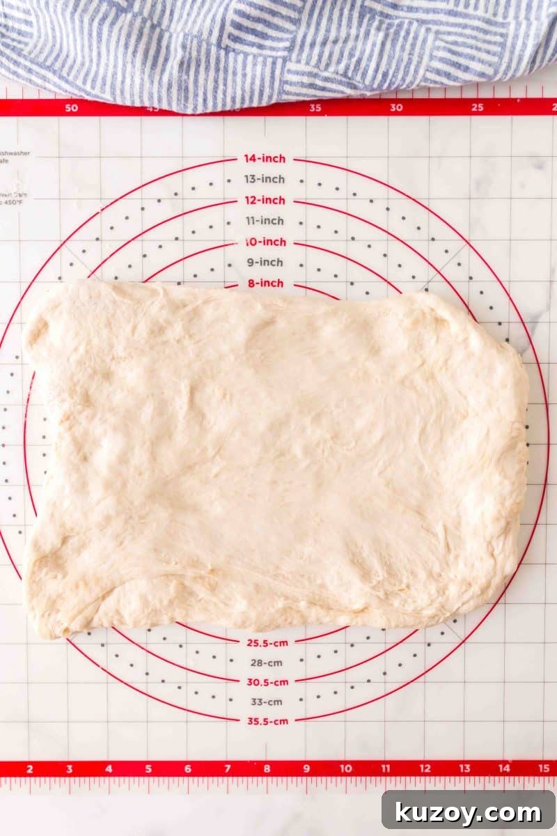 A rectangle of French bread dough before it's rolled into baguette log shapes – Hostess At Heart
