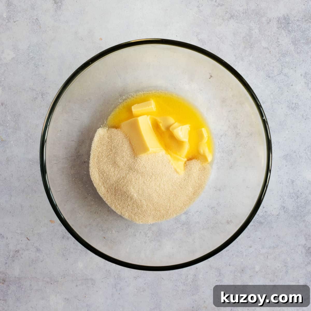 Butter and sugar in a bowl.