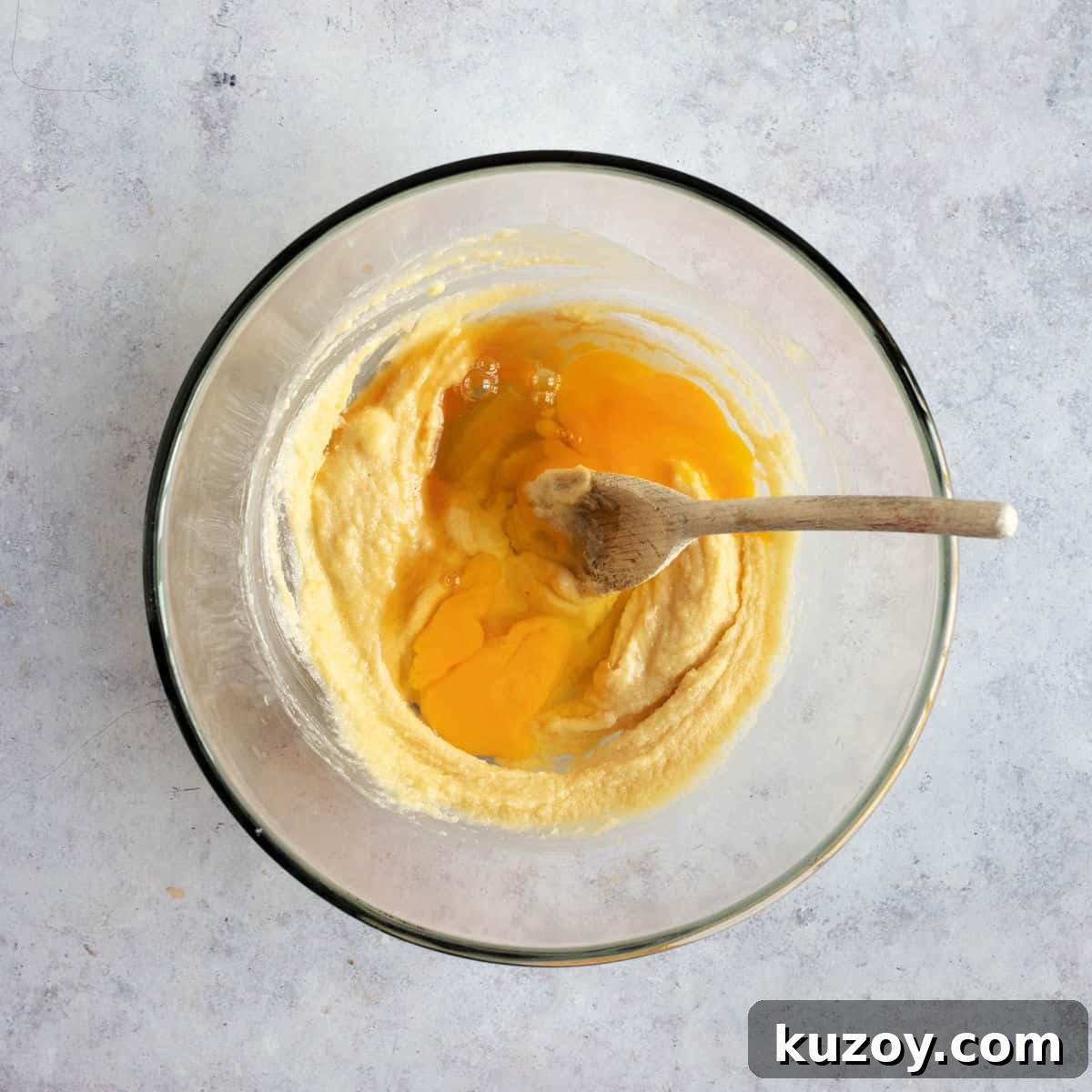 Eggs added to creamed butter and sugar.