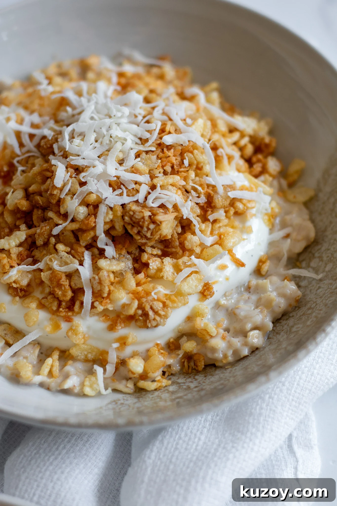 Porridge with coconut puffed rice and vanilla yoghurt.