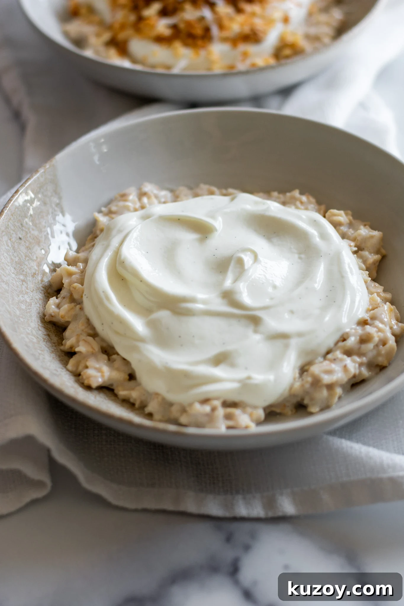 Porridge topped with vanilla yoghurt.