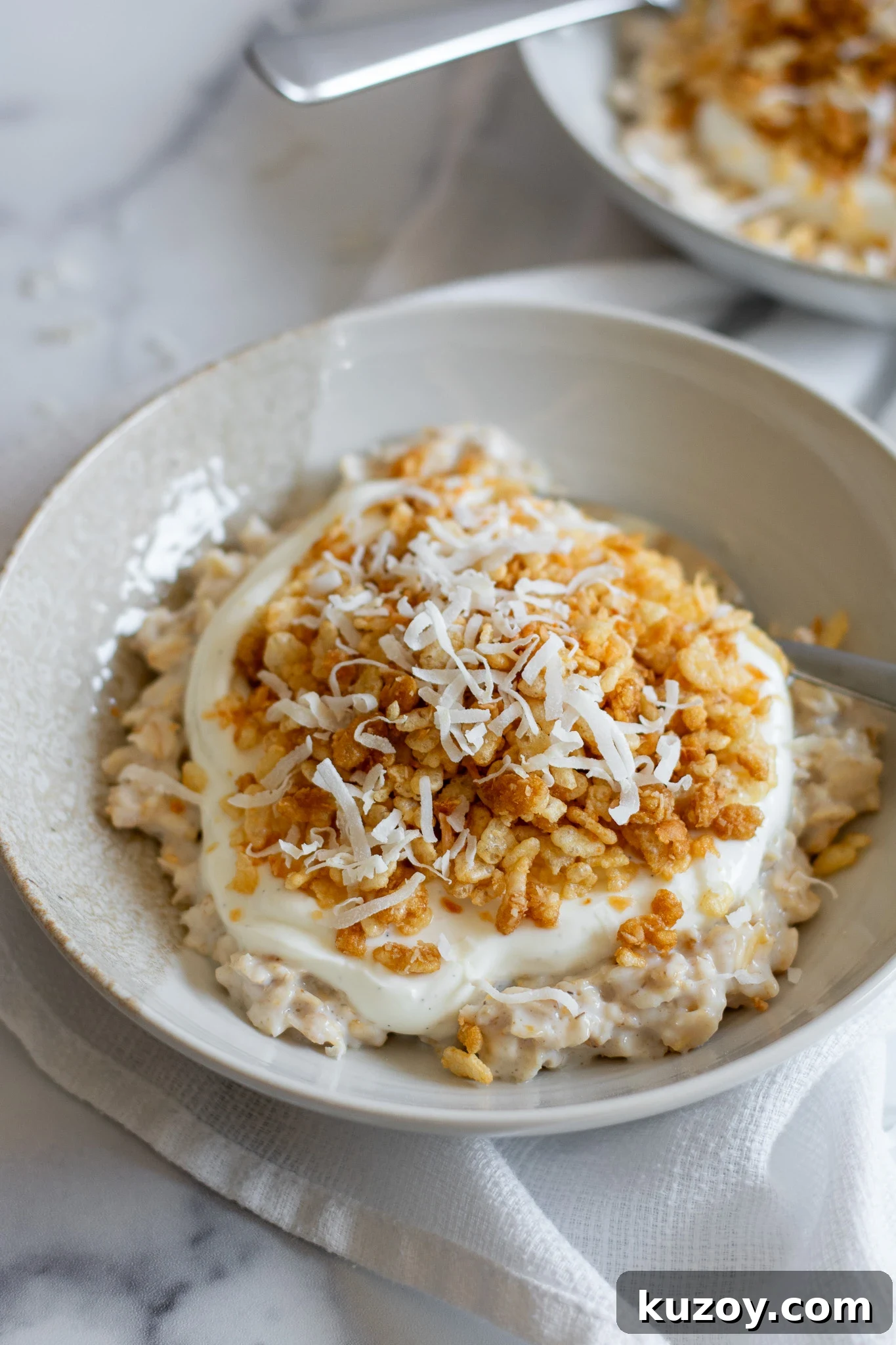 Porridge with coconut puffed rice and vanilla yoghurt.