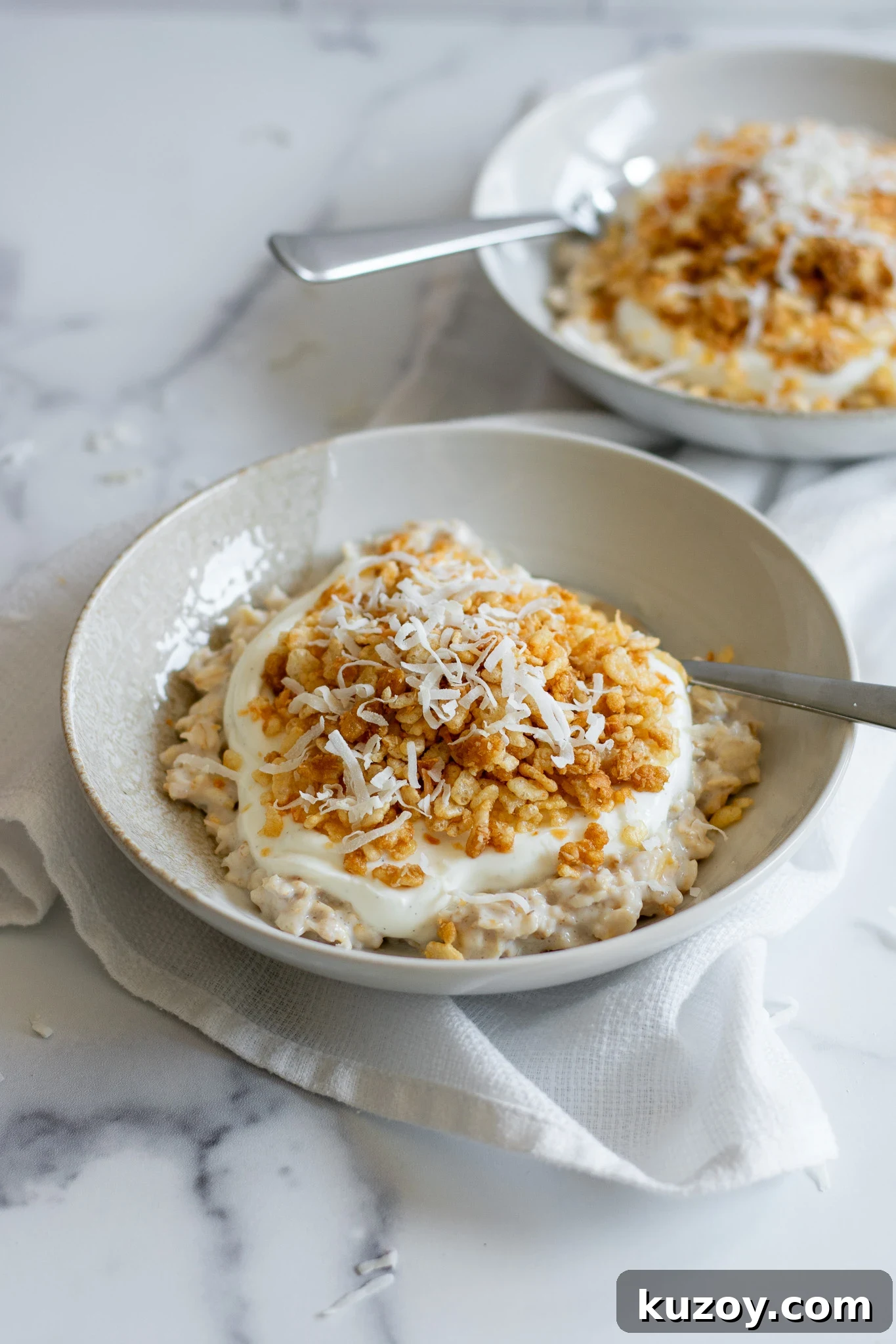 Porridge with coconut puffed rice and vanilla yoghurt.