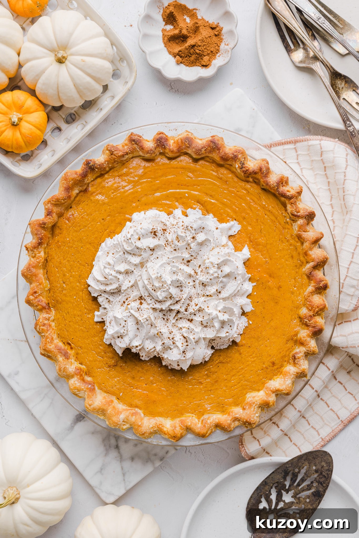 Healthy pumpkin pie topped with whipped cream.