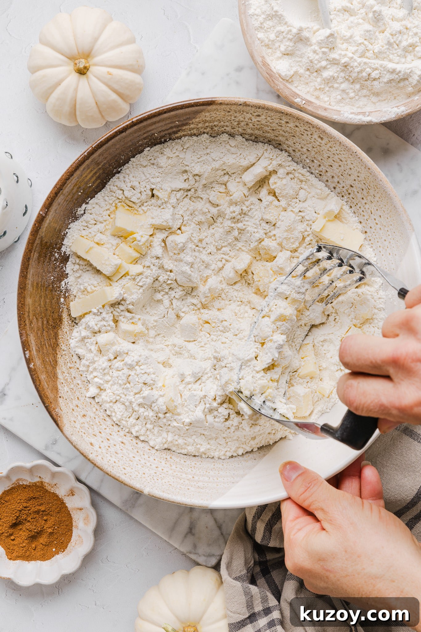 Whole wheat pie crust being rolled out for healthy pumpkin pie.