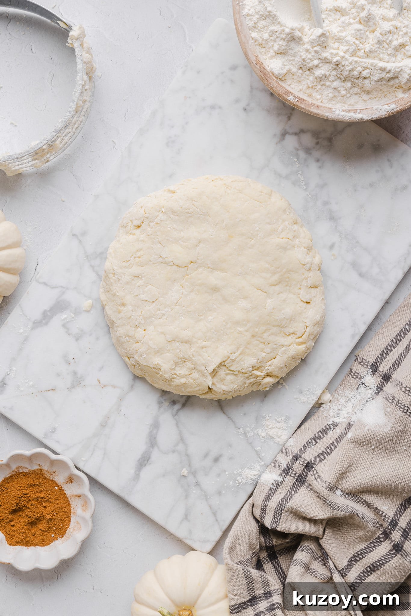 Healthy pumpkin pie crust formed into a dough disc.