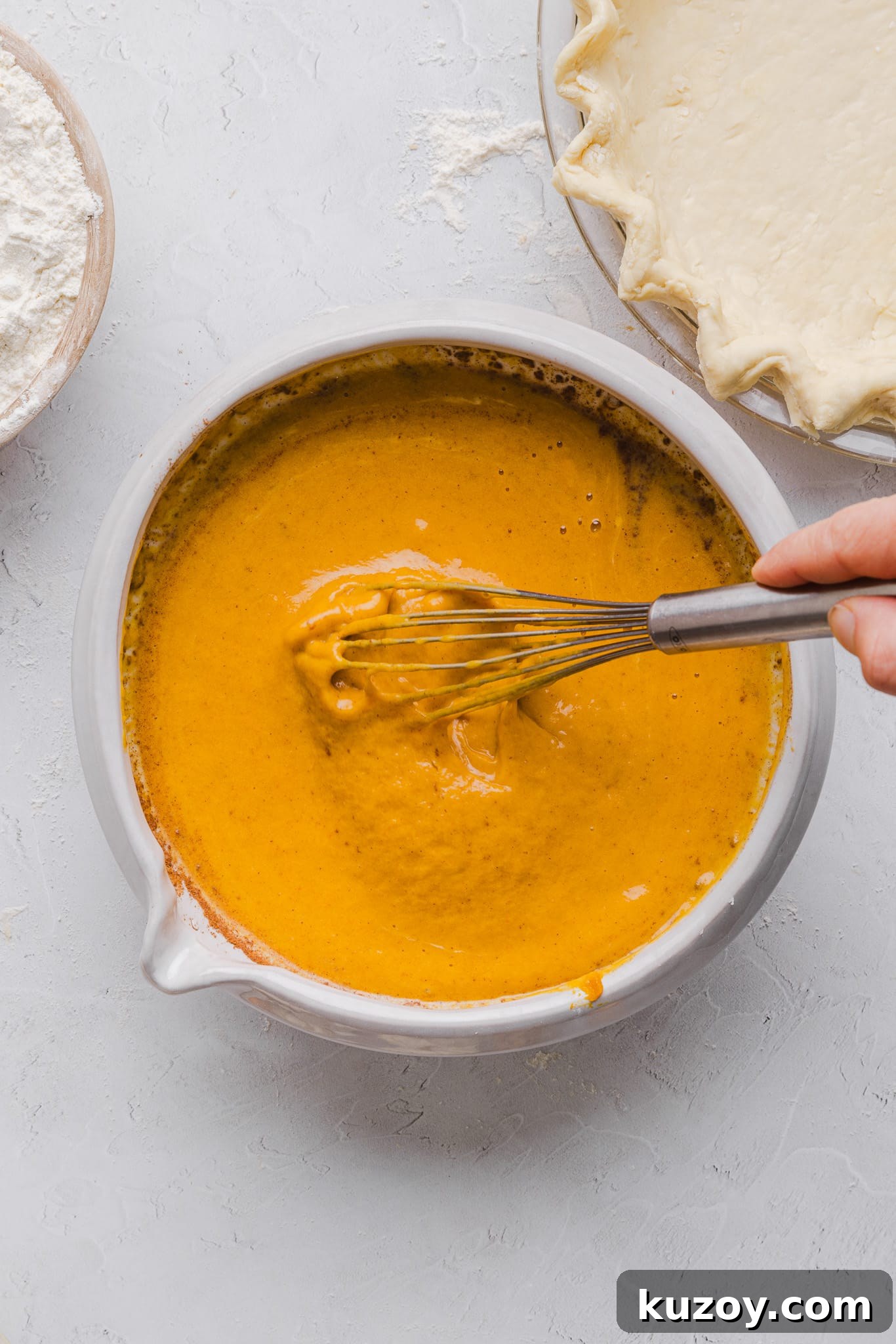 Healthy pumpkin pie filling mixed in a bowl.