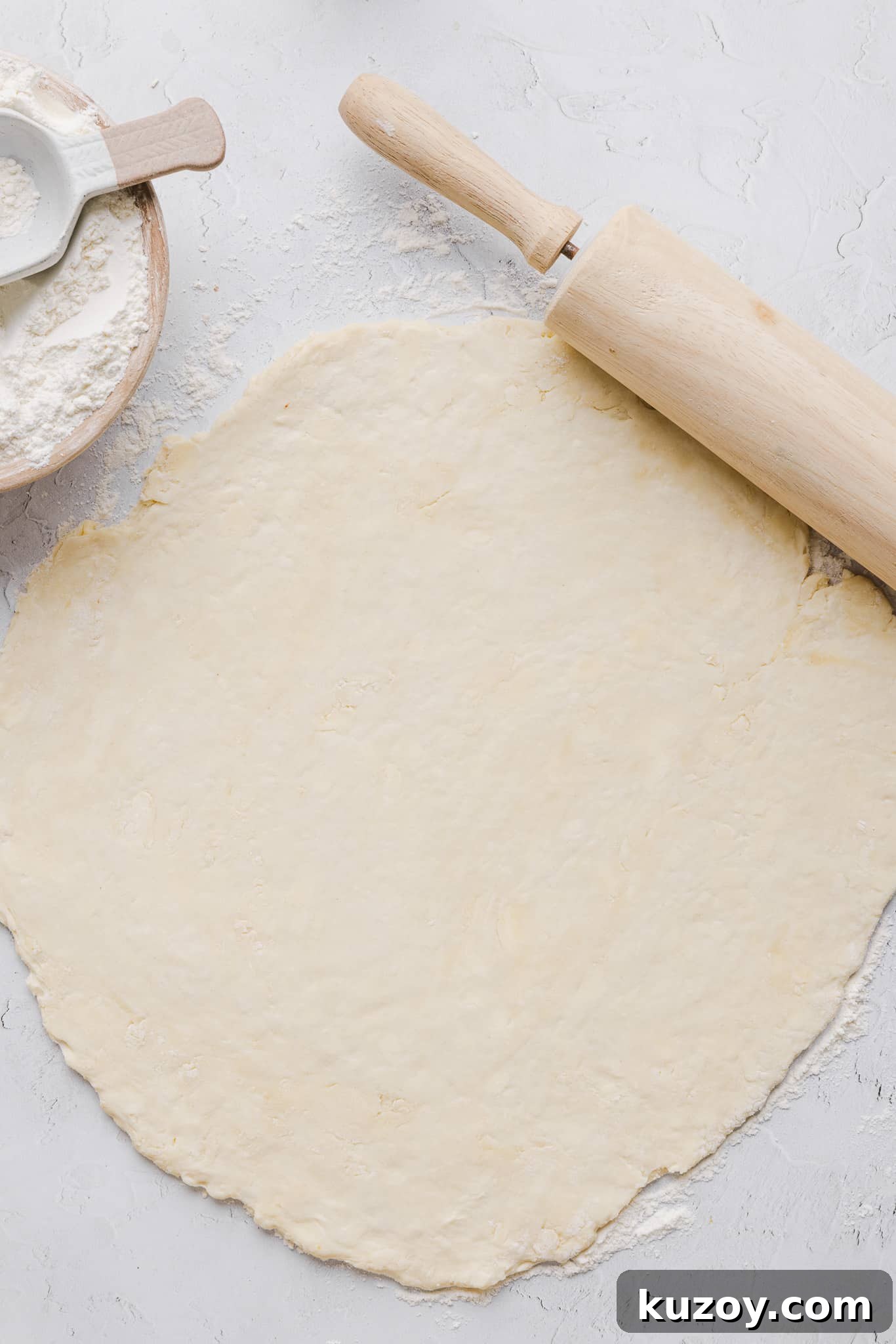 Healthy pumpkin pie crust rolled out on a countertop.