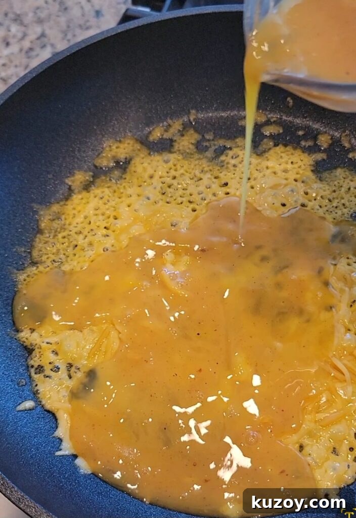 Pouring egg mixture into the skillet