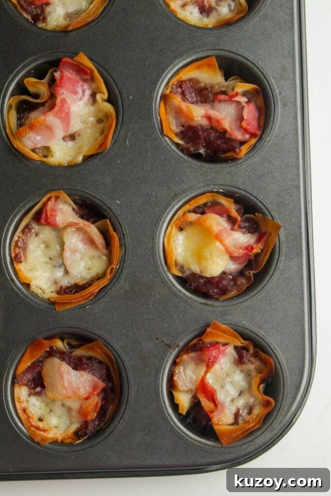 Close up of mini filo bites in a muffin tin.