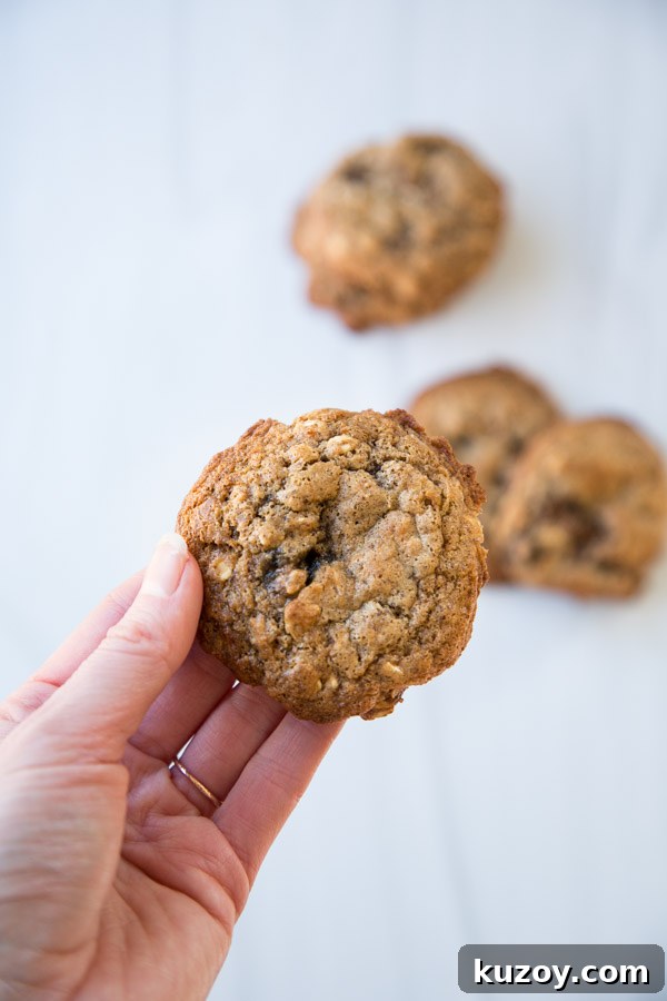 hand holding healthy almond flour and oatmeal cookie