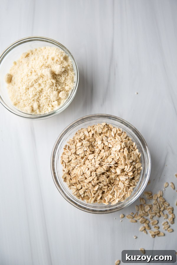 bowl of almond flour next to bowl of whole rolled oats