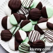large scalloped plate with chocolate dipped peppermint creams on it.