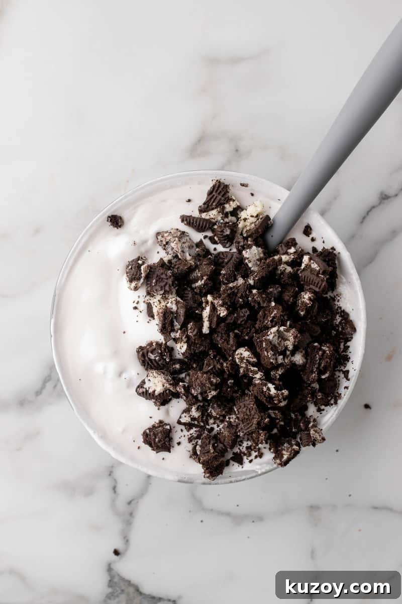 mixing the Oreos into the frosting