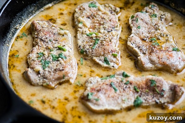Baked pork chops and sauce in skillet