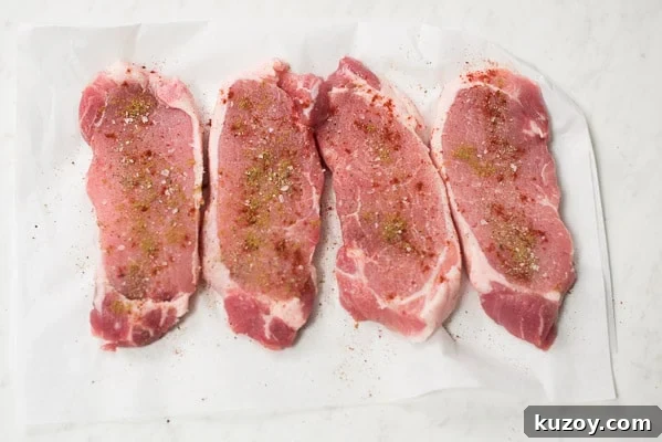 Raw pork chops with seasonings