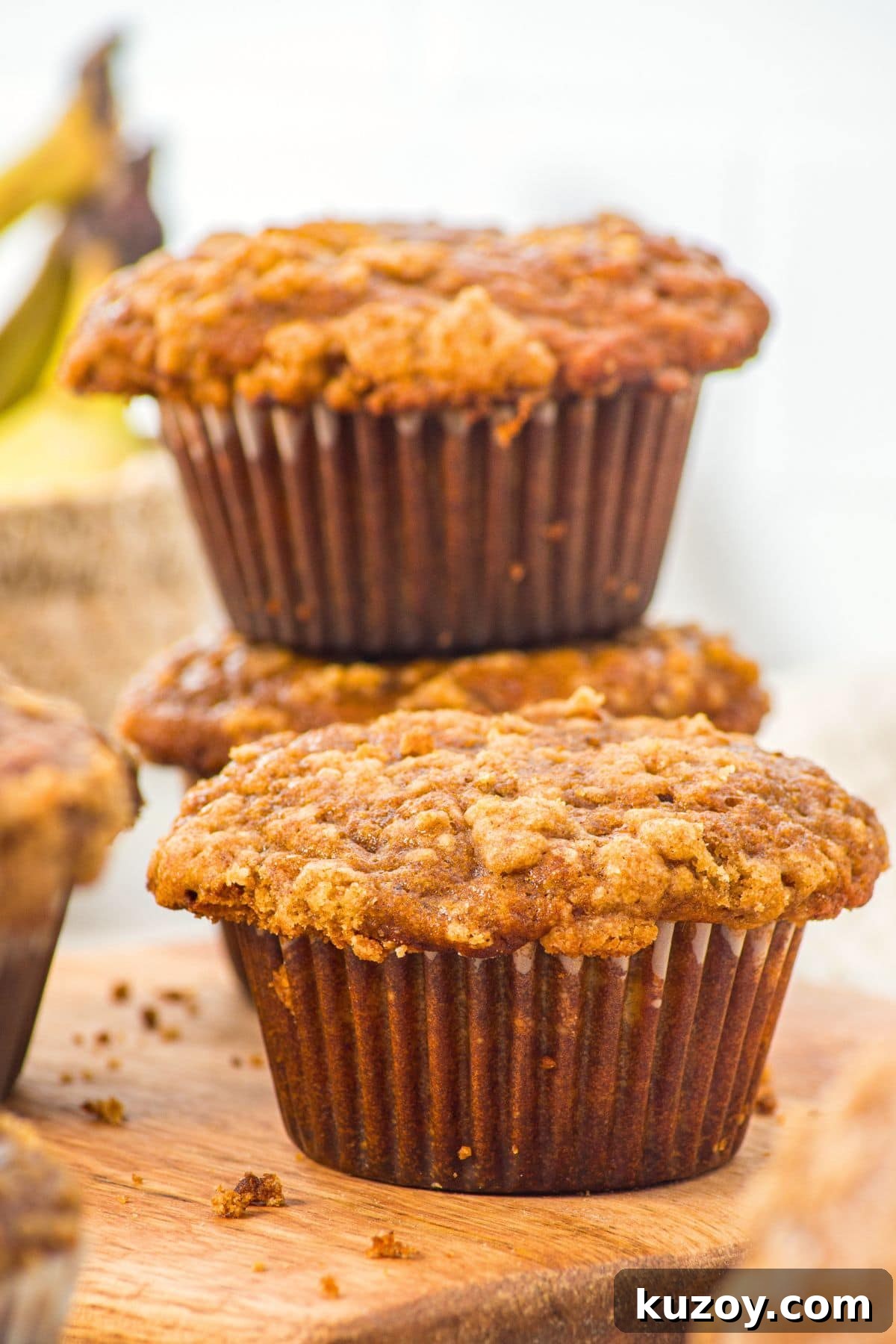 A stack of gluten dairy-free pumpkin banana muffins