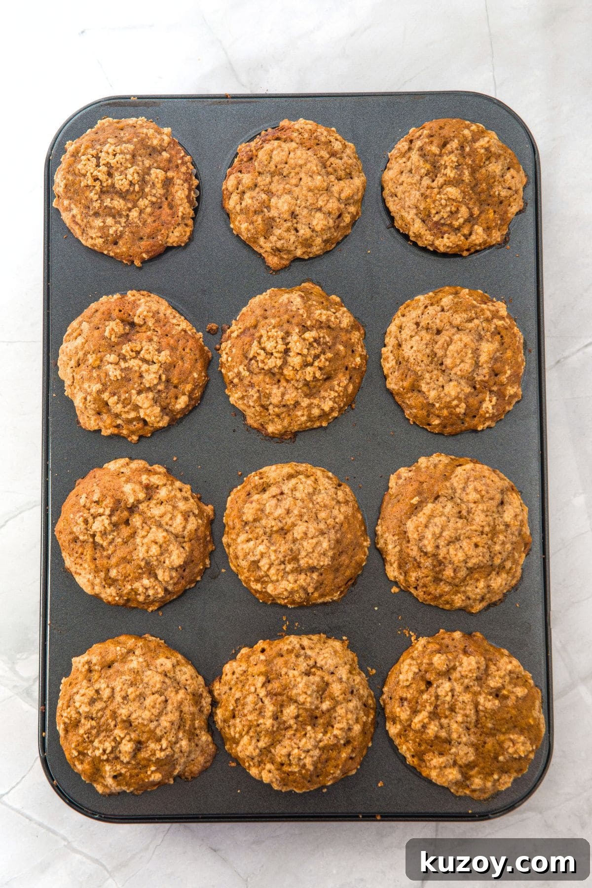 Freshly baked gluten-free banana pumpkin muffins in muffin pan