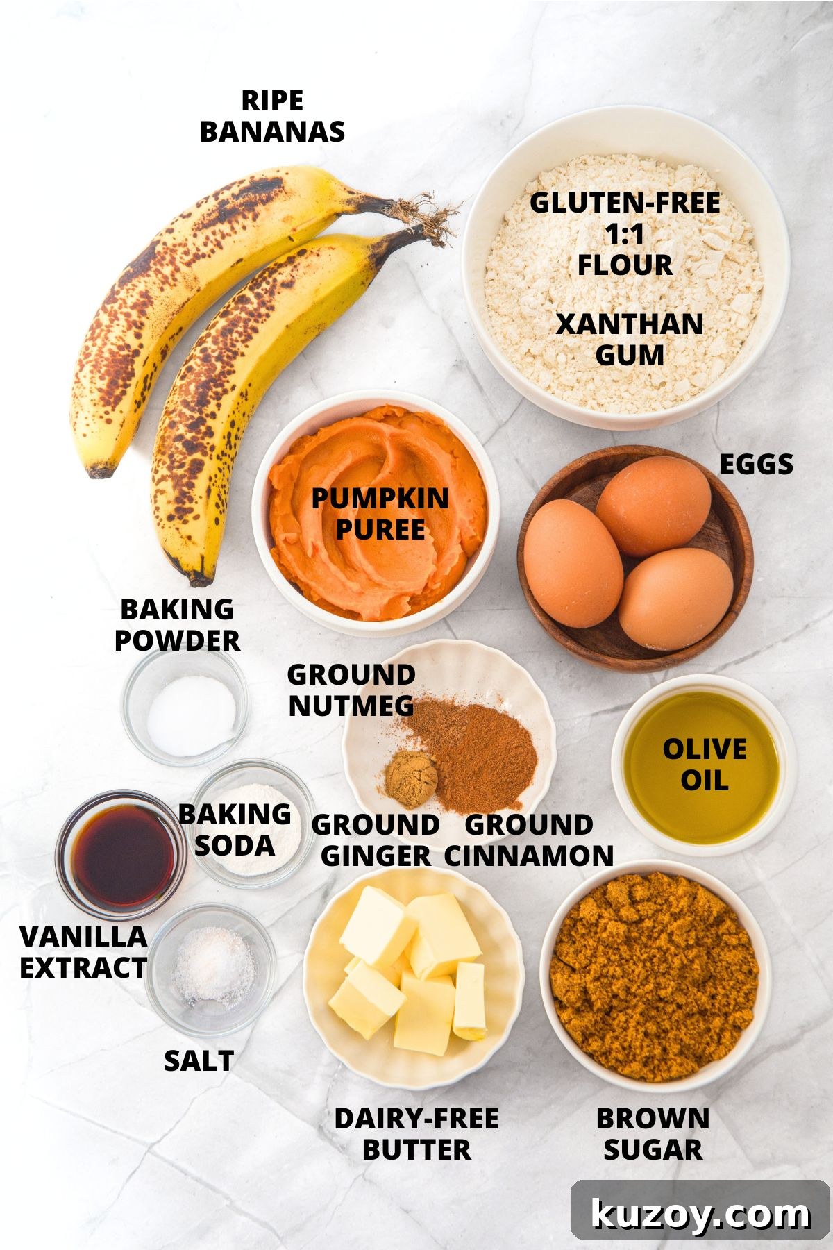 Ingredients for gluten-free pumpkin banana muffins recipe laid out on marble board.