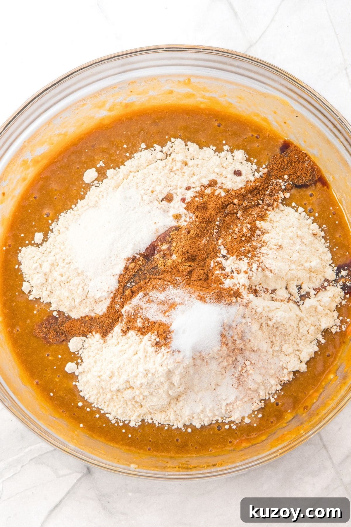 Flour mixture on top of brown batter