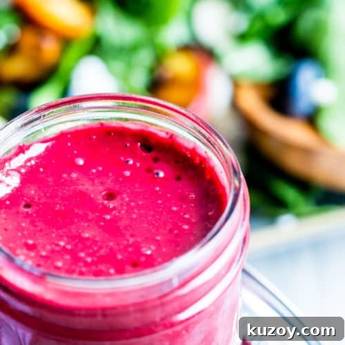 Blueberry dressing in a glass mason jar.