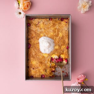 Strawberry cheesecake dump and bake cake with a serving scooped out to show layers.